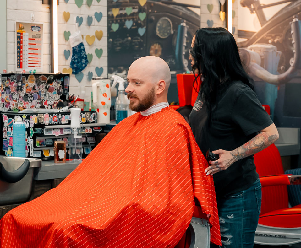 man in barber chair about to get haircut